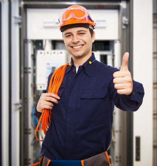 Electrician working with all safety practices in place