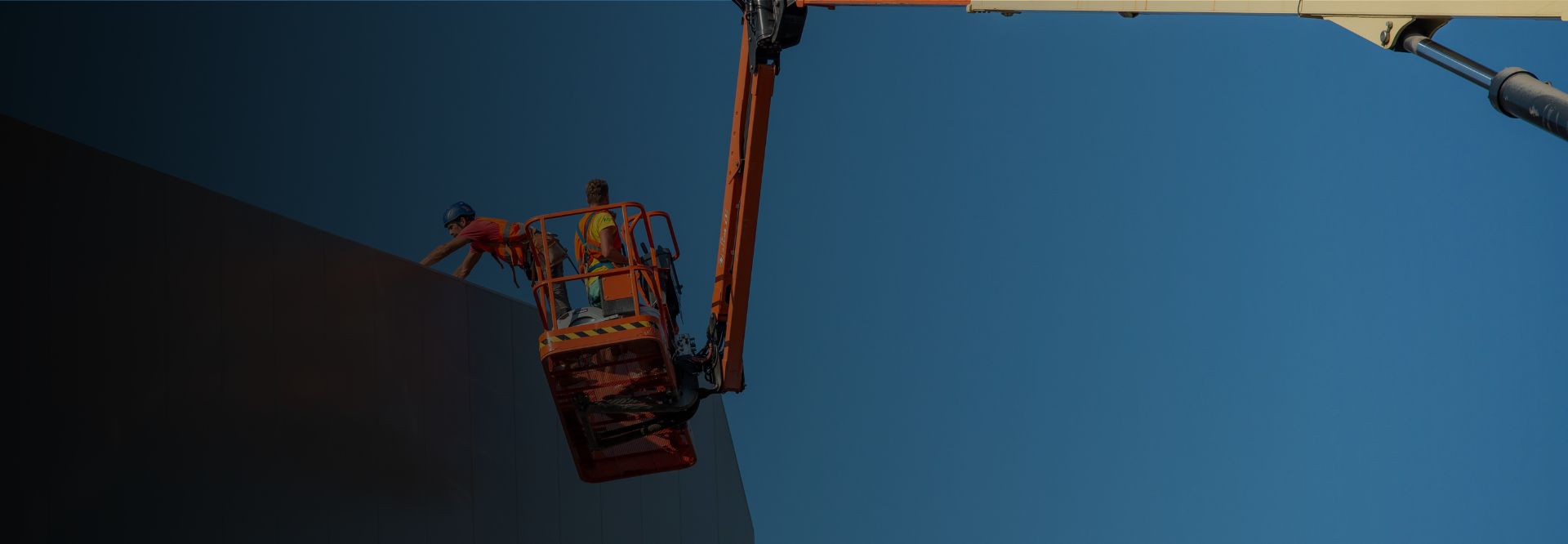 Worker working on an elevated platform with safety protection implemented