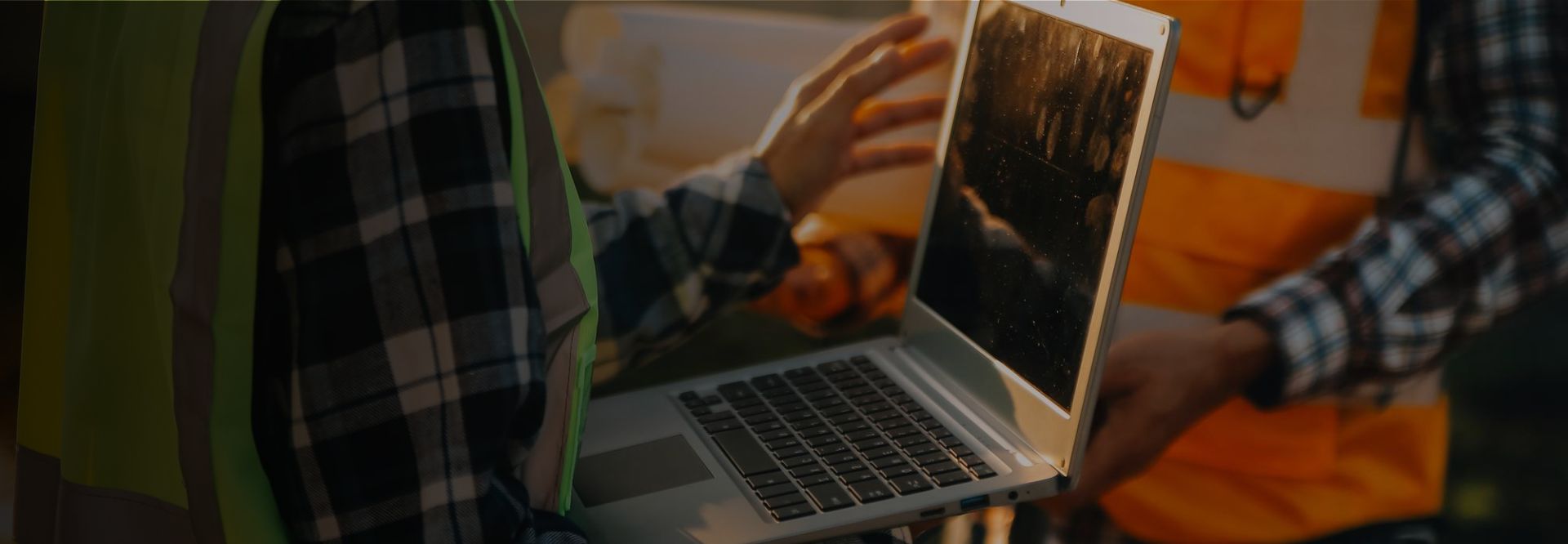 Construction worker using an online system to track safety procedures