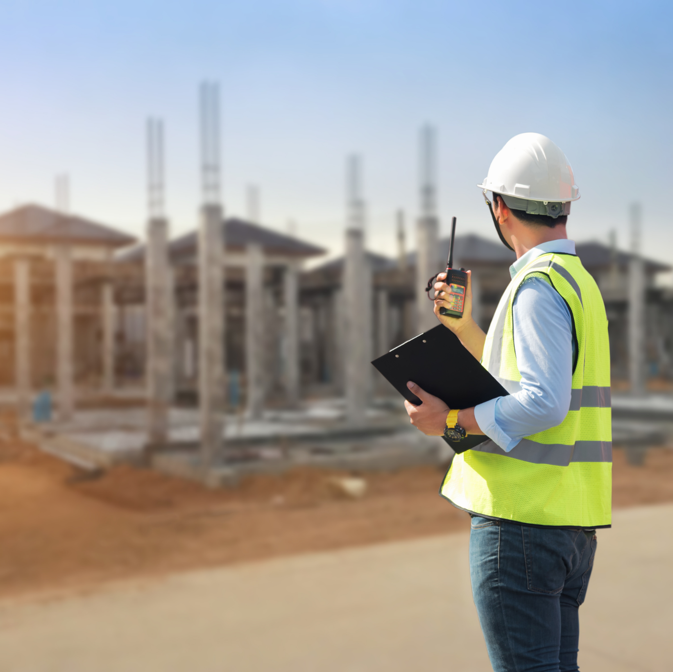 Supervisor monitoring construction site safely