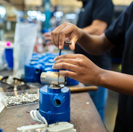 Industrial worker ensuring safety in production