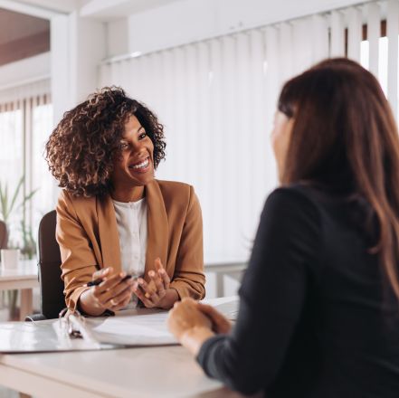 Professionals discussing workplace safety solutions across industries