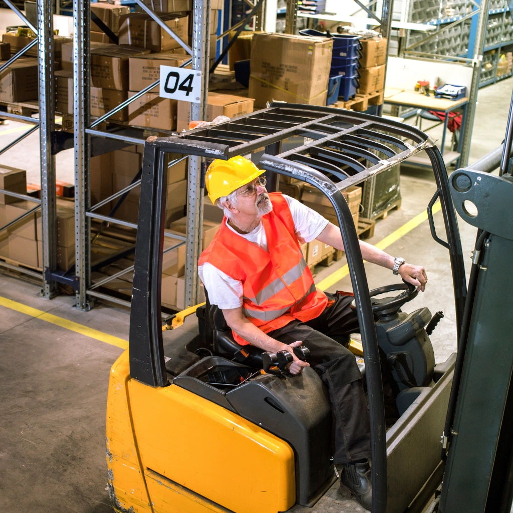 Crane operator attending refresher course on machinery control and safe lifting techniques