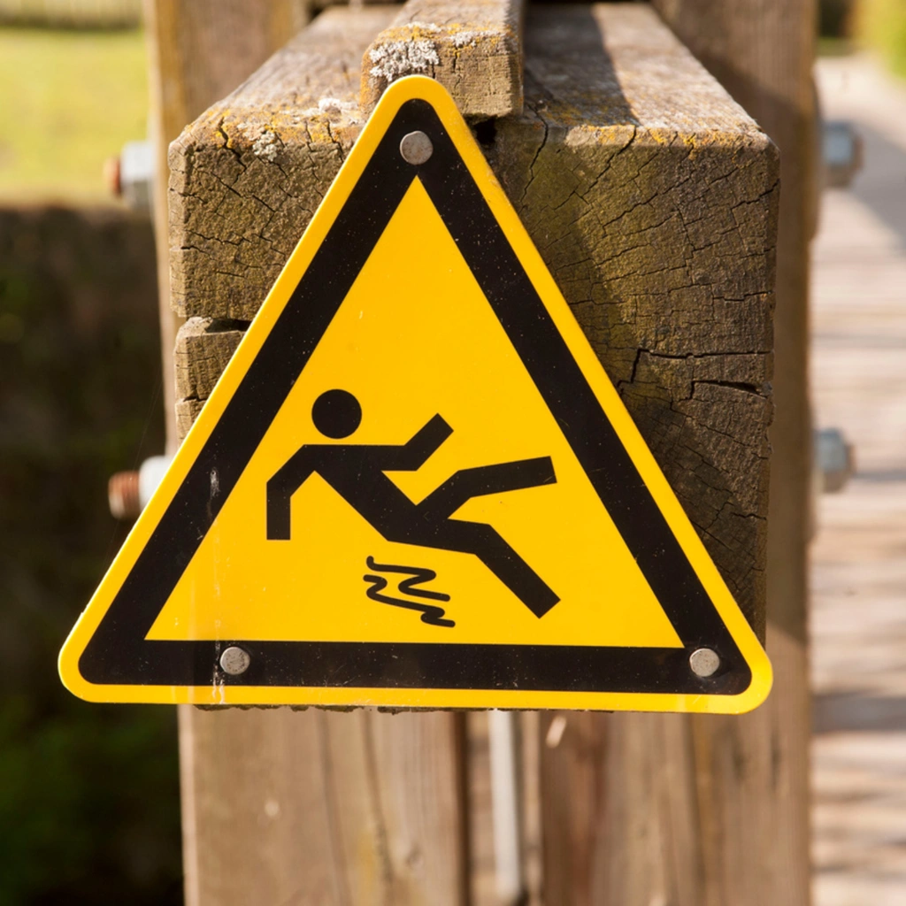 Workplace safety visual showing warning sign to prevent slips, trips, and falls