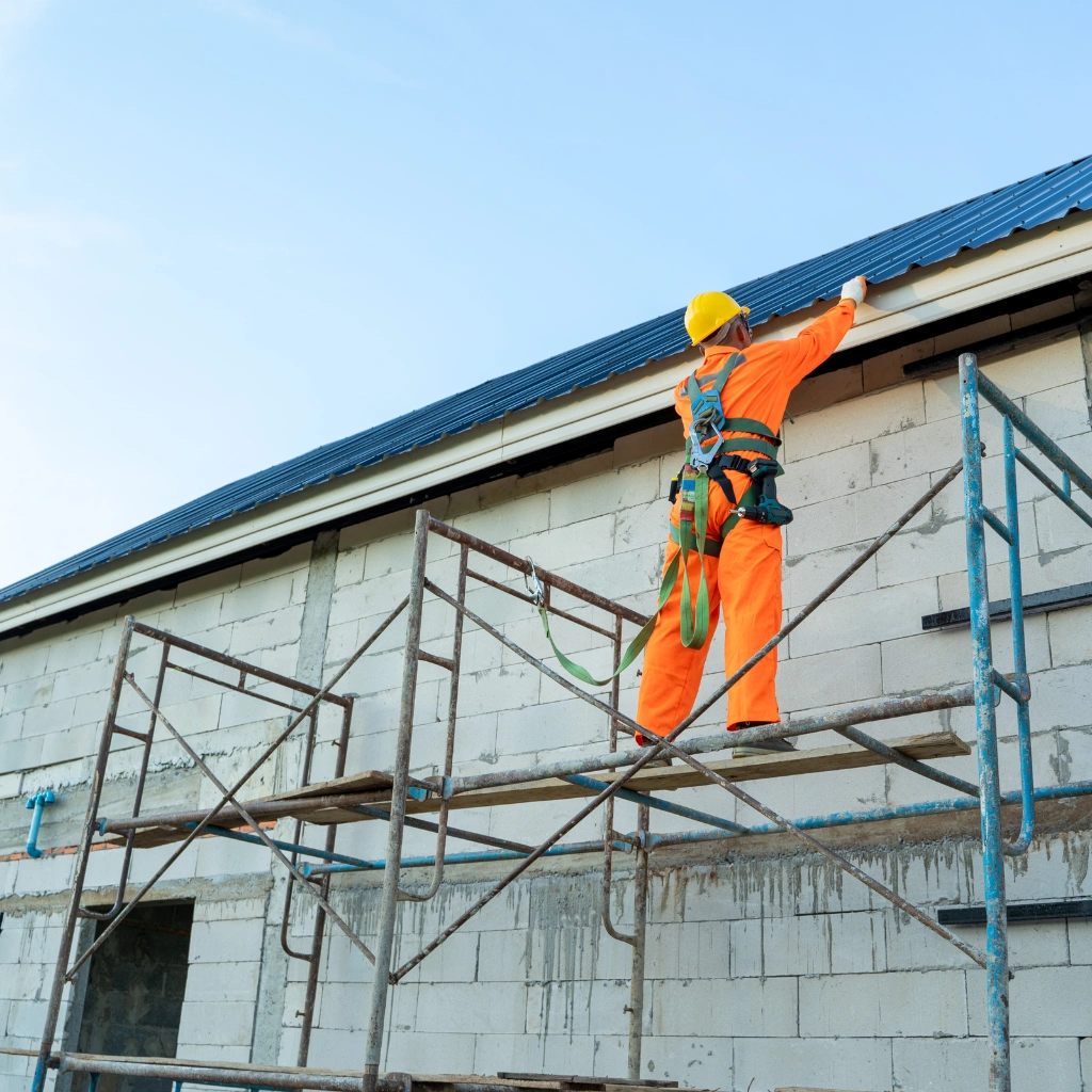 Construction employee performing elevated roofing work as part of CPO-approved WAH Refresher training