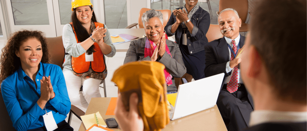 Joint Health and Safety Committee meeting with worker and management representatives collaborating.