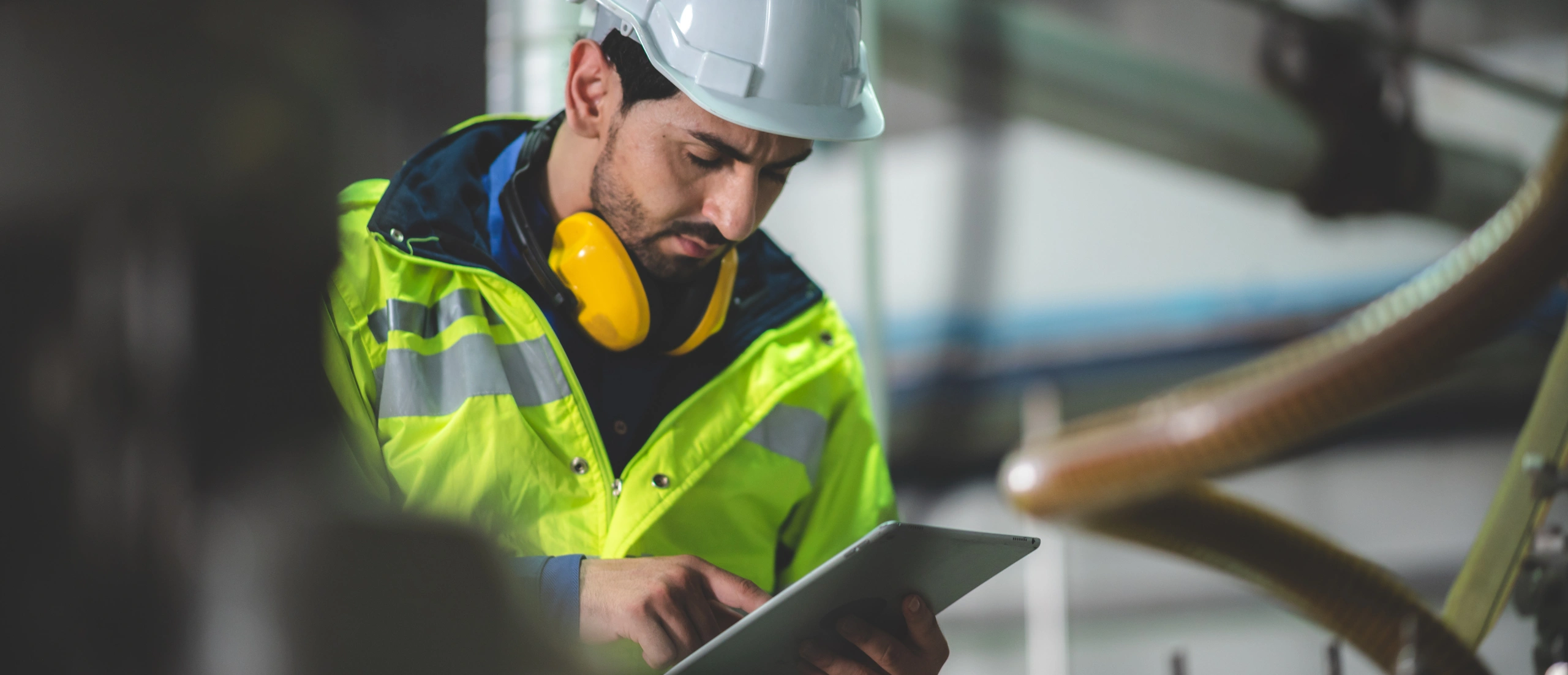 Safety professionals reviewing workplace safety procedures and ISO 45001 requirements.