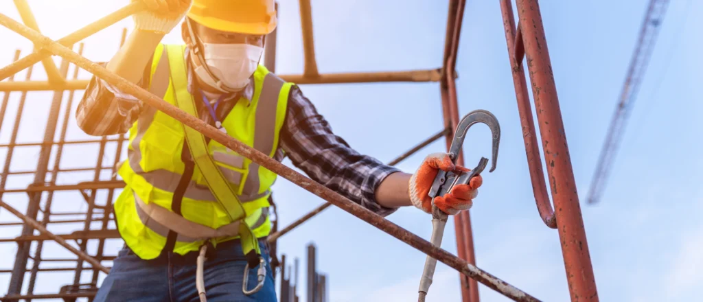 Worker undergoing Ontario Working at Heights training with fall protection gear.