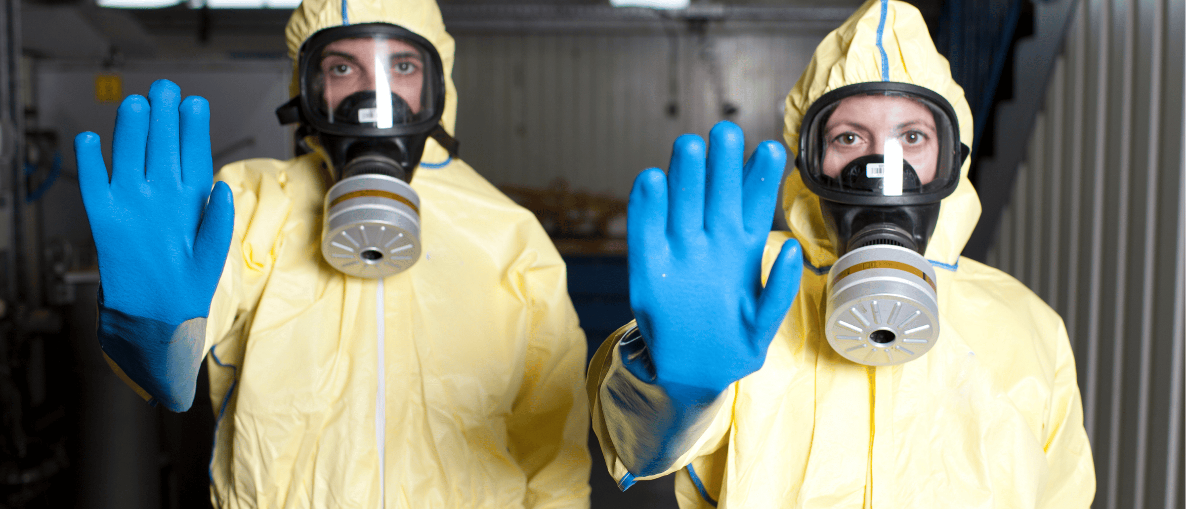 Two workers reviewing hazard assessment instructions together to ensure workplace safety compliance.