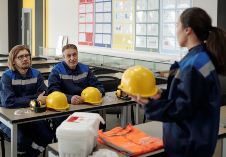 Occupational health and safety instructor delivering workplace safety training in a classroom environment